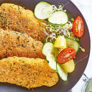 Milanesas de pechuga de pollo empanizada Caja 9.07KG